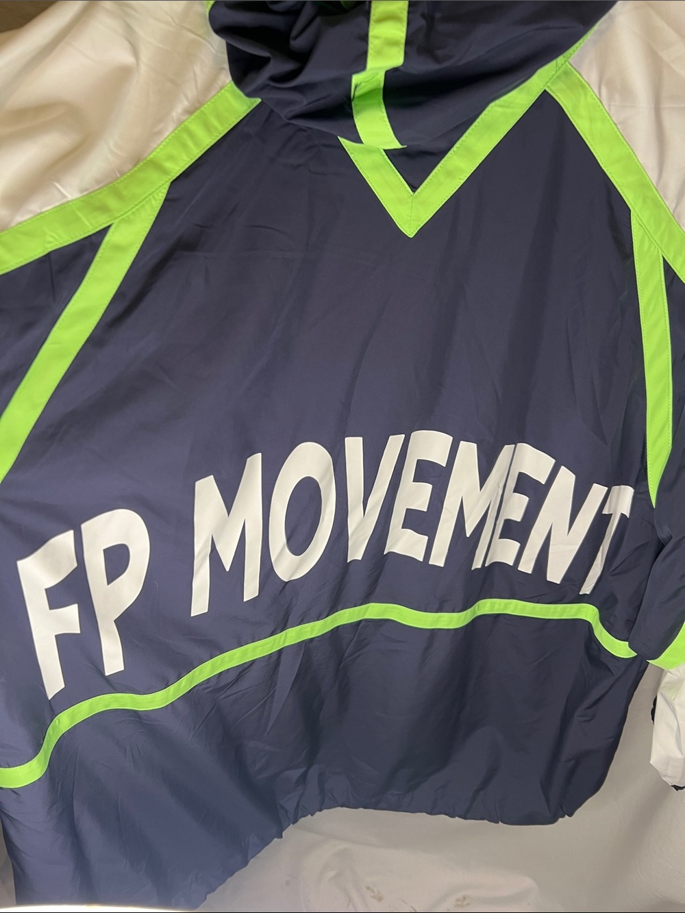 FP Movement Cares By The Wind block Logo in Navy and Lime Green Jacket. - Picture 11 of 13